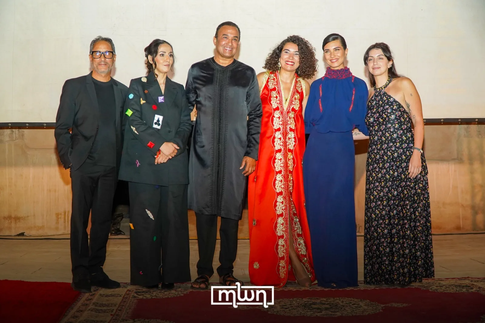 MARRAKECHsFF founder Ramia Beladel with Tûba Büyüküstün, Rachid El Ouali, Jalila Talemsi, Hicham Brahimi, and Daniela Stephan during the festival’s opening night at Badii Palace. / MWN Photography Team