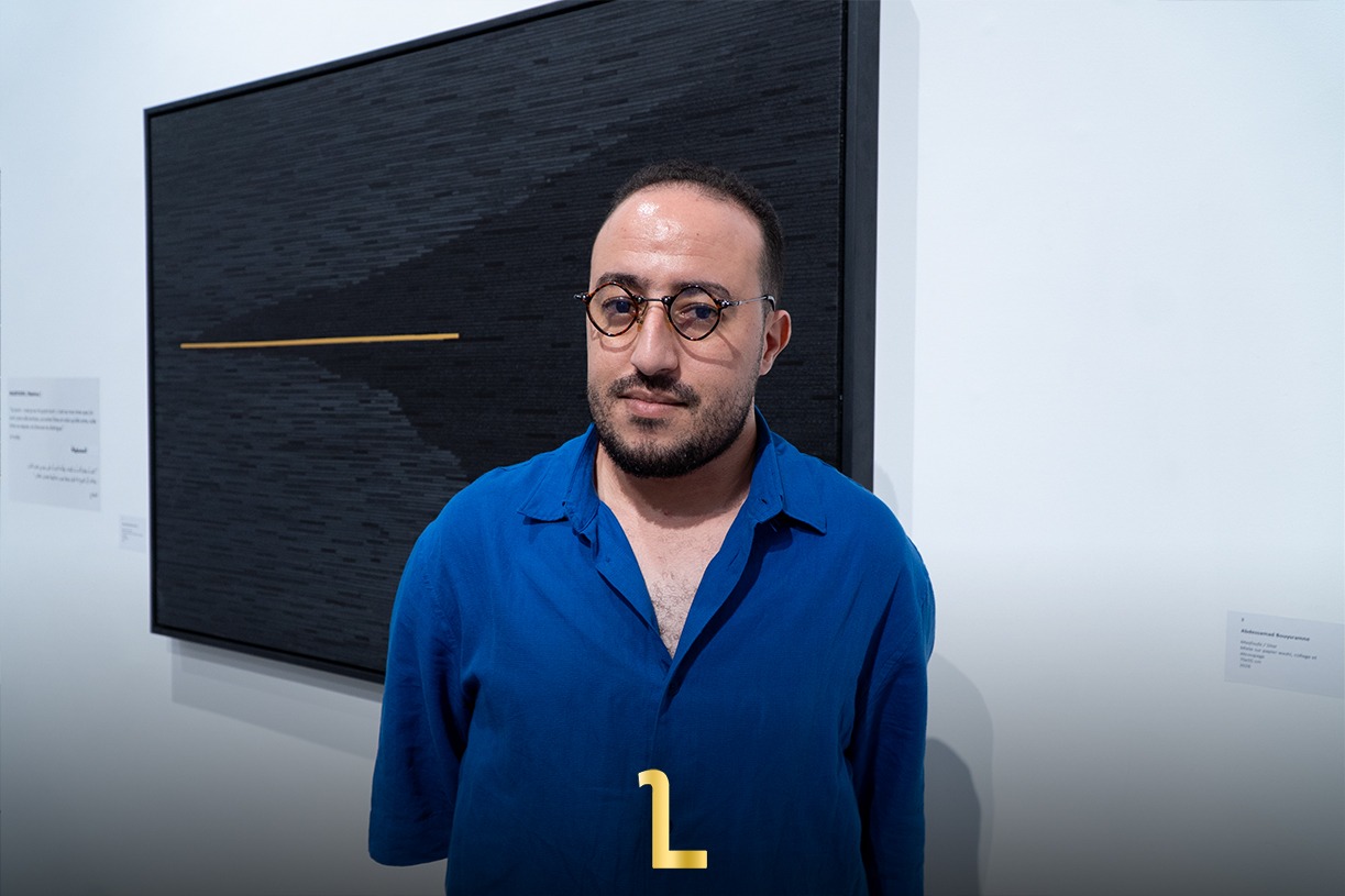 Moroccan artist Abdessamad Bouysramne at Abla Ababou Galerie in Rabat during his solo exhibition, “Arraqîm.” / MWN Photography Team